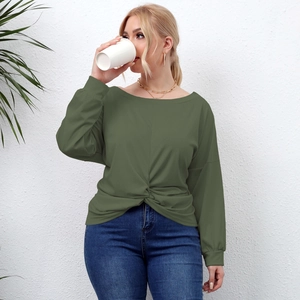 Detail of army green long sleeve shirt featuring a front twist knot and off-shoulder neckline