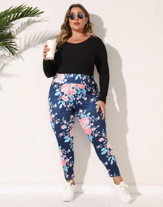 Detailed full-length shot of plus-size floral print leggings with black long sleeve top