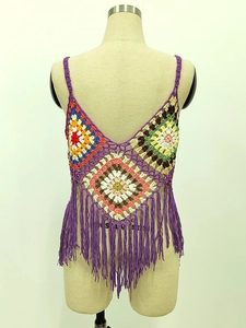 Detail of bohemian colorful crochet granny square camisole with purple fringe hem