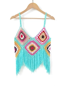 Detailed view of handmade crochet crop top with colorful granny squares and fringe trim