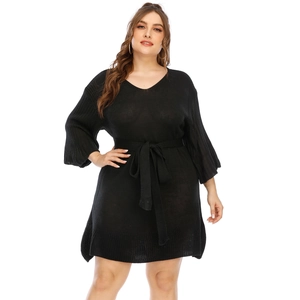 Elegant black knit dress with V-neck, bell sleeves and waist tie for a slim fit look