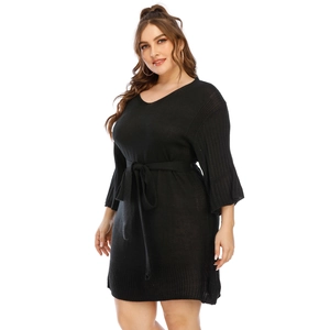 Elegant black knit V-neck flared sleeve dress with waist tie and slim fit silhouette