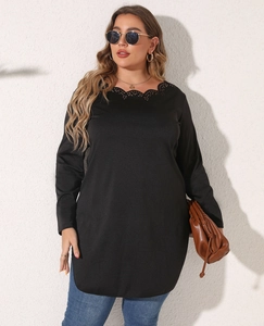Detailed view of the hollow scalloped lace neckline on a black plus size long sleeve top
