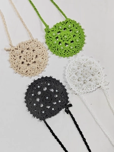 Detailed handmade crochet round charms with radial patterns and white bead accents
