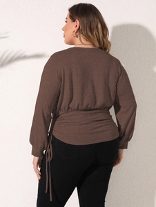 Detail of dark brown plus size sweatshirt featuring adjustable drawstring waist ruching