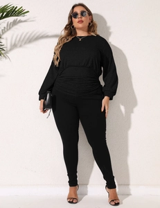 Detailed view of women's black drawstring waist sweatshirt with pleated fabric texture
