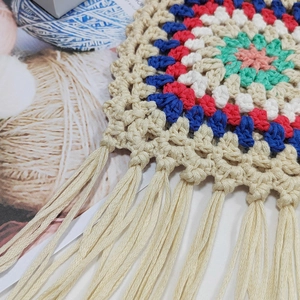 Handmade crochet crossbody bag with bohemian colorful pattern and long fringe tassels