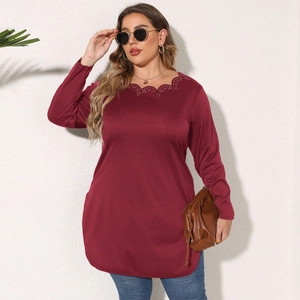 Detail of burgundy long sleeve top showing scalloped neckline and hollow-out laser cut pattern