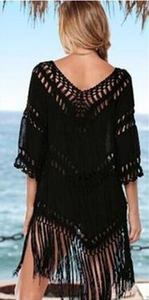 Women's black crochet beach cover-up with hollow knit pattern and fringe hem