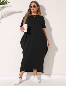 Detail of plus size black maxi dress showing loose hemline and comfortable cotton fabric