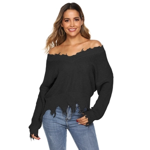 Women's off-the-shoulder black knit sweater with distressed fringe and ripped details
