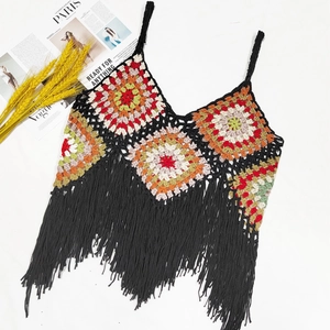 Bohemian handmade crochet crop top with colorful geometric patterns and black fringe tassels