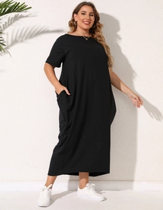 Loose black plus size maxi dress with short sleeves and pockets, casual floor-length style