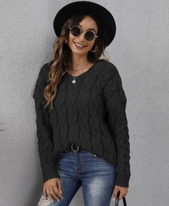 Detailed cable knit texture of black V-neck hoodie sweater with stylish accessories