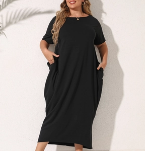 Detail of loose black maxi dress showing cotton blend fabric texture and large side pockets