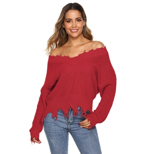 Women's V-neck red knit sweater with distressed edges and irregular fringe hem detail