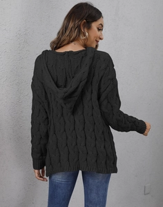 Back view of thick black cable knit hoodie sweater showing textured knit craftsmanship