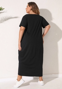 Back view of a loose black plus size maxi dress with short sleeves and pocket detail