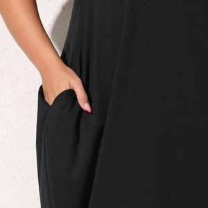 Detail view showing side pockets and soft jersey fabric of this casual black maxi dress