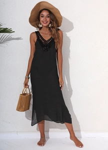 Chic black backless beach dress with crochet lace V-neck detail and summer accessories