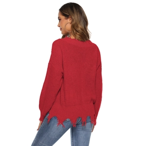 Detailed back view of red distressed knit sweater with fringe hem and ripped details