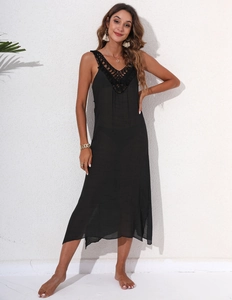 Detail of black crochet hollow-out V-neckline on a lightweight beach sundress
