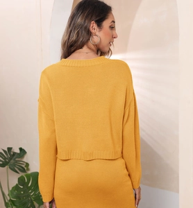 Rear view of ginger knit cardigan and skirt set showing premium tight-knit texture