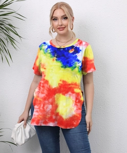 Detail shot of the side slit design on a vibrant tie-dye oversized t-shirt for women