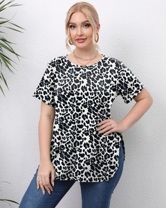 Detail of plus size leopard print top with crew neck and curved side slit hemline