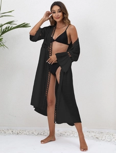 Three-piece black bikini set with long sheer lace cover-up for beach vacation