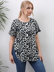 Detail showing high-quality leopard print texture and side slit curved hem of women's top