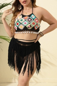 Two-piece bohemian crochet beach set featuring floral halter top and black fringe skirt