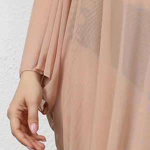 Detail of sheer pleated mesh bikini cover up dress in nude pink with wide sleeves