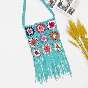 Colorful granny square crochet crossbody bag with bohemian floral patterns and long tassels