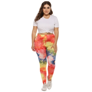 Detailed view of high-waisted leggings with vibrant colorful tie-dye patterns and high elasticity
