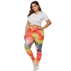 Close-up of women's slim fit leggings featuring vibrant irregular tie-dye print