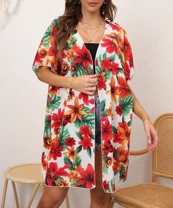 Detail of vibrant tropical floral print on a lightweight summer beach cover-up cardigan