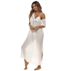 Detailed view of white crochet lace trim and high side slit on beach cover-up maxi dress