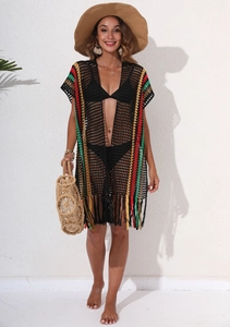 Detail of crochet beach cover-up with colorful stripes and fringe on black mesh knit
