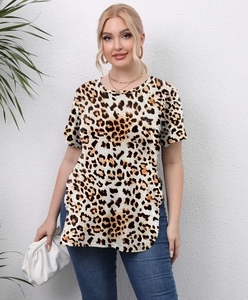 Detail of leopard print plus size top with crew neck and side slit hem on model