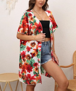 Detail view of women's floral sunscreen cover up with tropical print for beach vacation