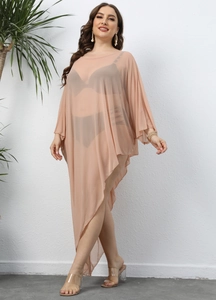 Macro detail of sheer apricot mesh fabric with irregular hem and batwing sleeve design