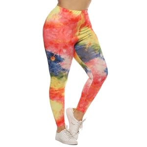 Detail of vibrant colorful tie-dye yoga leggings featuring elastic slim fit fabric