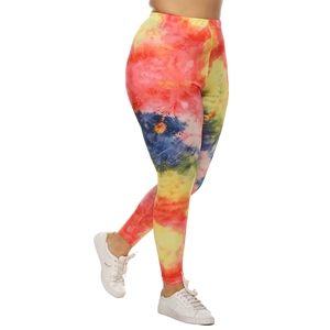 Detail showing high-waist stretch fabric with vibrant red and yellow tie-dye print patterns