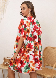 Detailed back view of white floral chiffon beach cover-up with red lily tropical prints