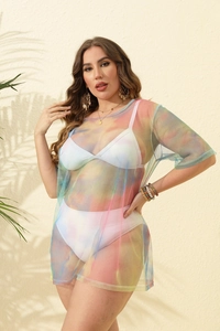 Detail of colorful tie-dye mesh cover-up for plus size beachwear with tropical shadow