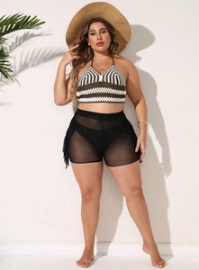 Detail of plus size crochet halter top with striped pattern and mesh beach cover-up shorts