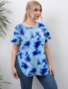 Detail of blue tie-dye pattern on short sleeve top with side slit and round neck
