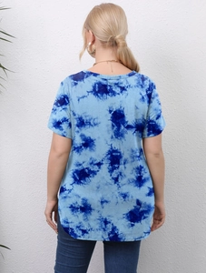 Detail view of tie-dye printed pattern and side split hem on plus size women's t-shirt