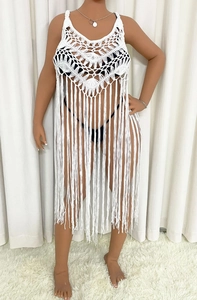 White crochet beach cover-up for women featuring intricate patterns and long fringe tassels